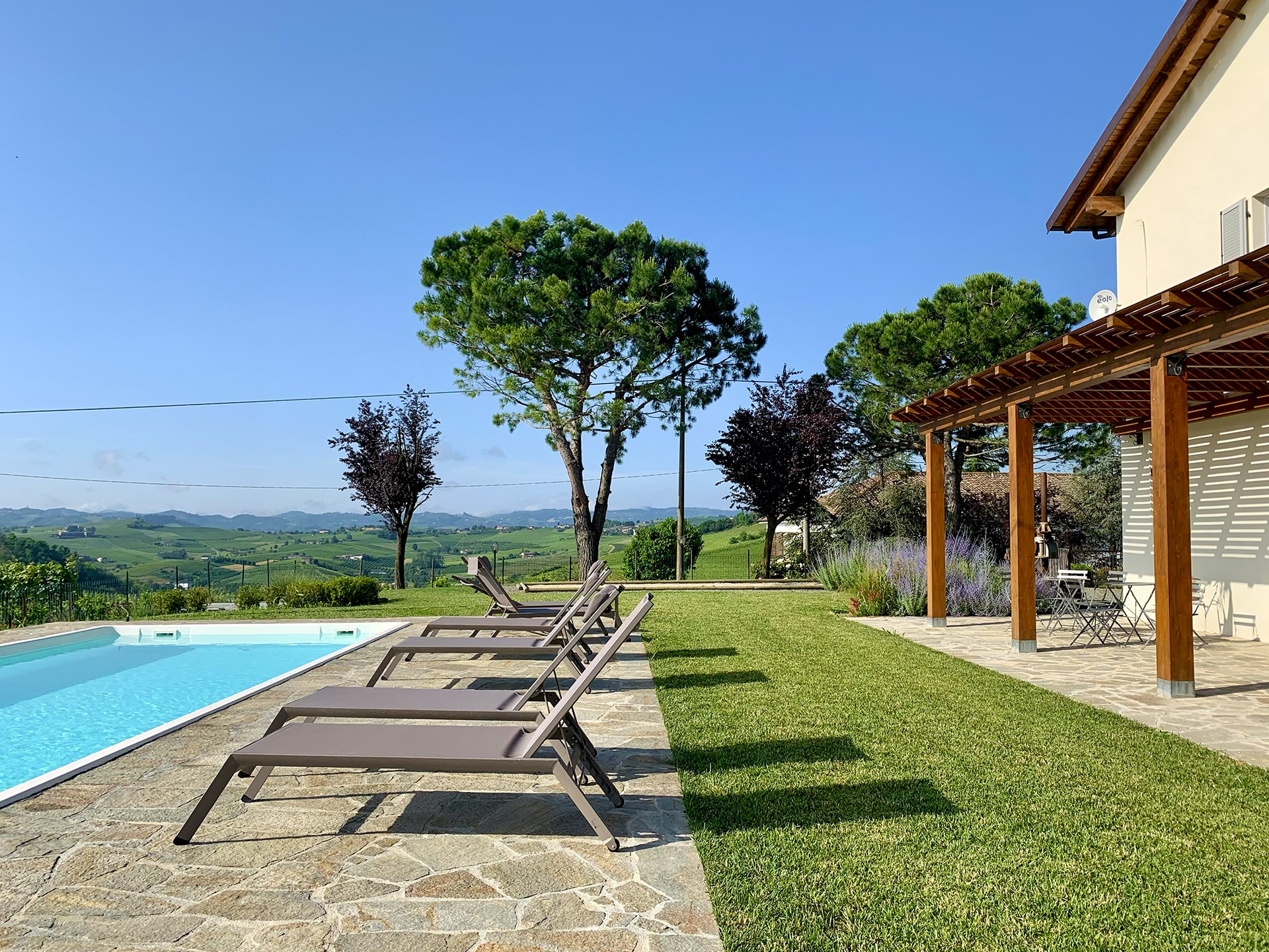 Pool terrace with garden and vineyard views